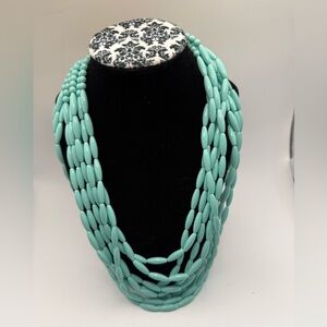 Vintage multi strand teal metal oval plastic bead